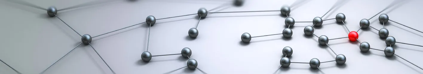 Network of metal balls, one being red