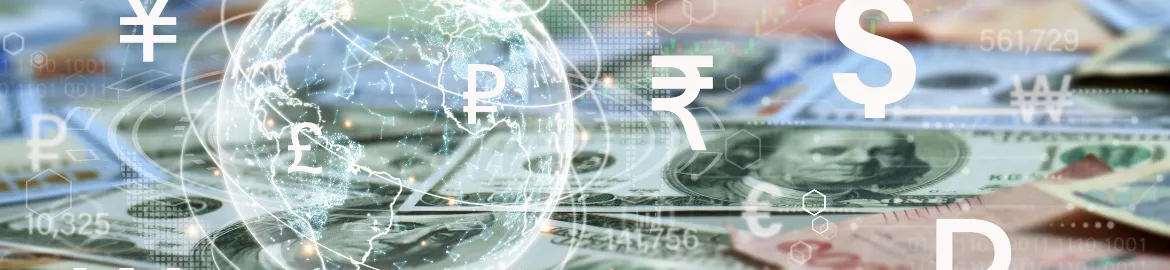 Transparent Globe with different currency symbols to the side and a table of money in the background