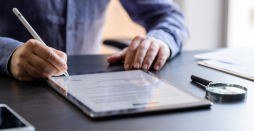 Professional man signing a digital contract on a tablet—ideal visual for promoting Adobe Approved Trust List (AATL) digital certificates used in secure PDF signing and paperless workflows. Perfect for PKI, SSL, and digital identity solutions.